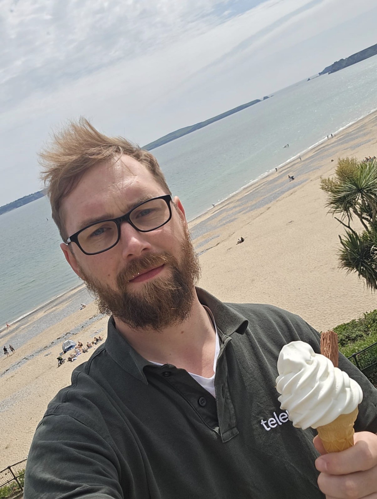 Photo by the beach holding an ice cream
